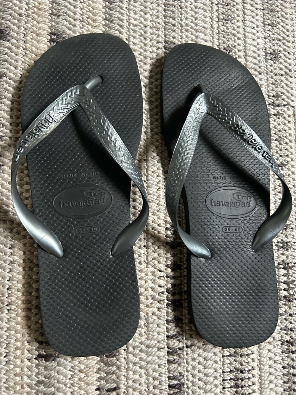 Havaianas metallic gray (silver) and black flip flops. Size Womens 7/8